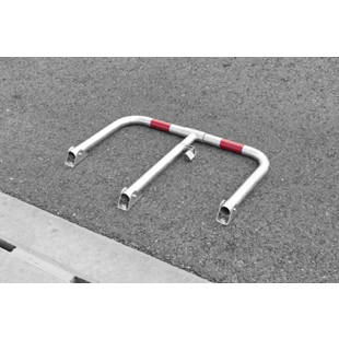 Parking barrier with red reflective stripes