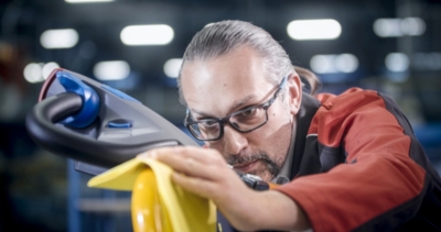 Employee polishes a product from in-house production