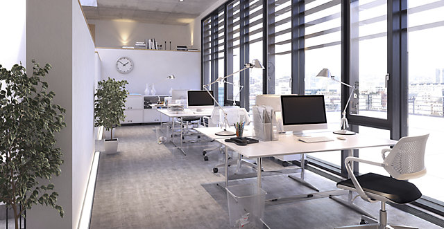 An modern office with light grey furniture