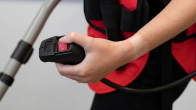 Handheld button operation of an industrial vacuum cleaner