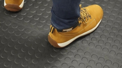 Black anti-fatigue garage floor mats with an interlocking design