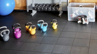 Black rubber floor tiles for converting a garage into a home gym