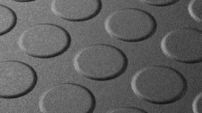 Black industrial floor tiles with an anti-slip surface