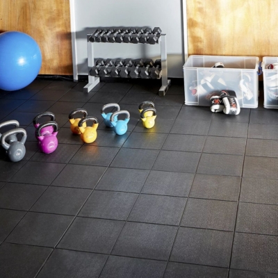 Rubber floor tiles turning a garage into a home gym