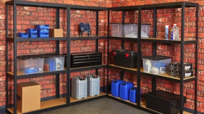 Garage shelving unit against a brick wall with garage equipment neatly stored