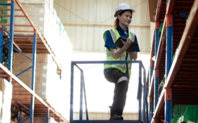 Warehouse staff inspecting shelving