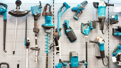 Large pegboard with garden power tools hanging