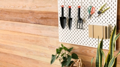 Small pegboard used in garden sheds to hang gardening hand tools