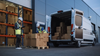 Warehouse staff place a delivery on a pallet